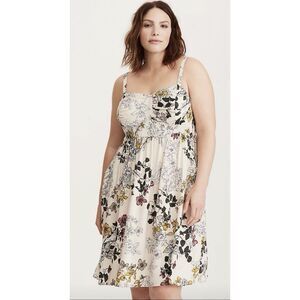 Torrid floral sun dress features adjustable spaghetti straps and convenient pock